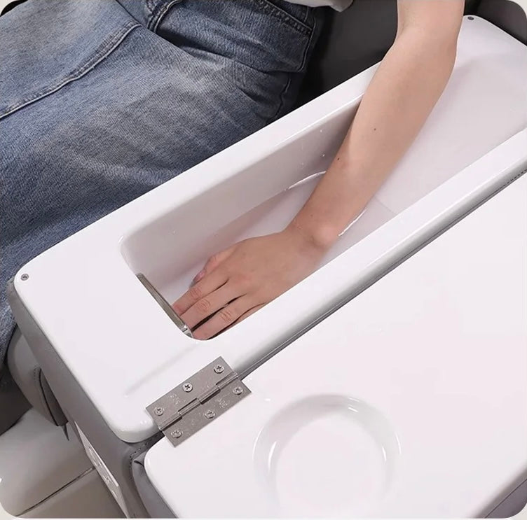 Client receiving manicure and pedicure in Milano Relax Pro spa chair in modern nail salon